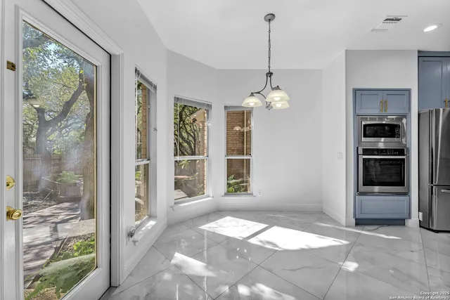 a bedroom with a large bed and a flat screen tv