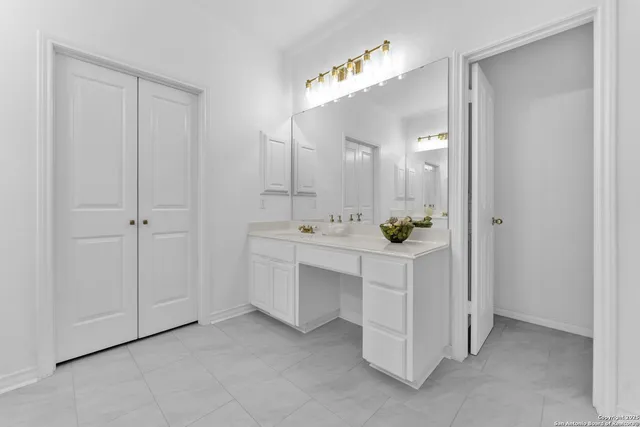 a bathroom with bathtub and window