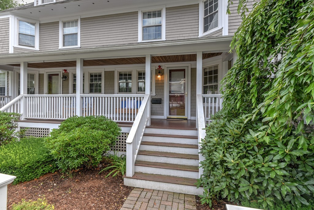 58 Webster Street, Unit 58 Newton, MA 02465 - Photo 1 of 28 a front view of a house with a yard