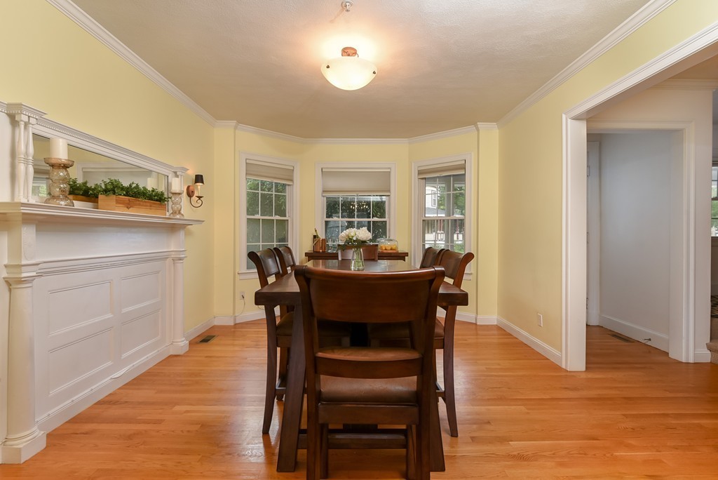 58 Webster Street, Unit 58 Newton, MA 02465 - Photo 12 of 28 a view of a dining room with furniture window and wooden floor