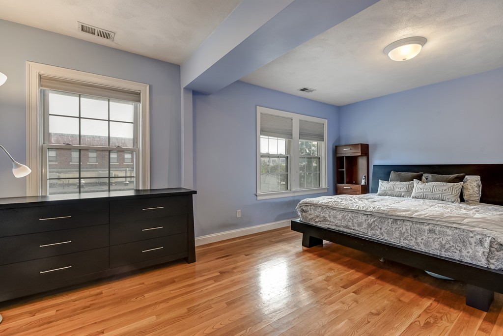 58 Webster Street, Unit 58 Newton, MA 02465 - Photo 16 of 28 a bedroom with a bed and a window