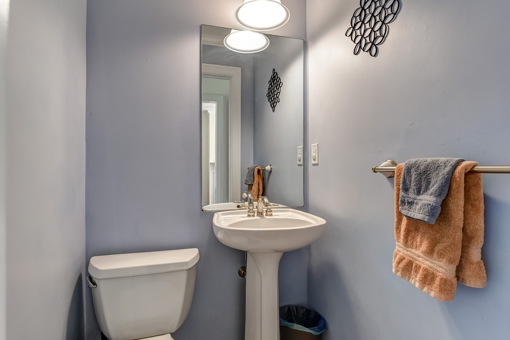 58 Webster Street, Unit 58 Newton, MA 02465 - Photo 21 of 28 a bathroom with a sink toilet and mirror