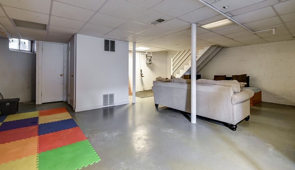 58 Webster Street, Unit 58 Newton, MA 02465 - Photo 24 of 28 a living room with furniture and a rug