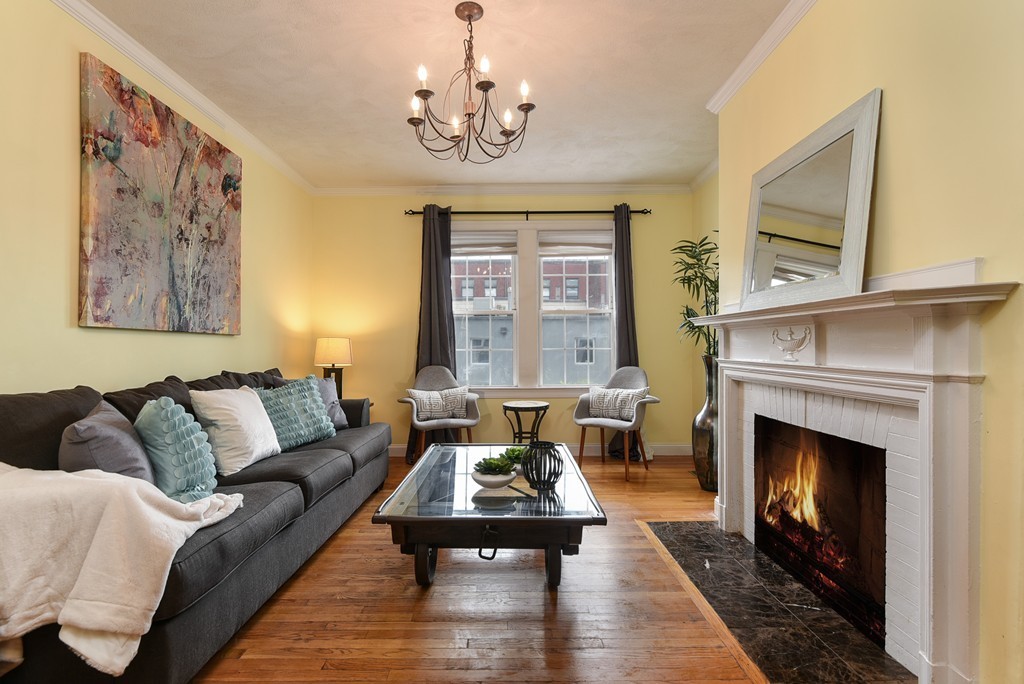 58 Webster Street, Unit 58 Newton, MA 02465 - Photo 8 of 28 a living room with furniture and a fireplace