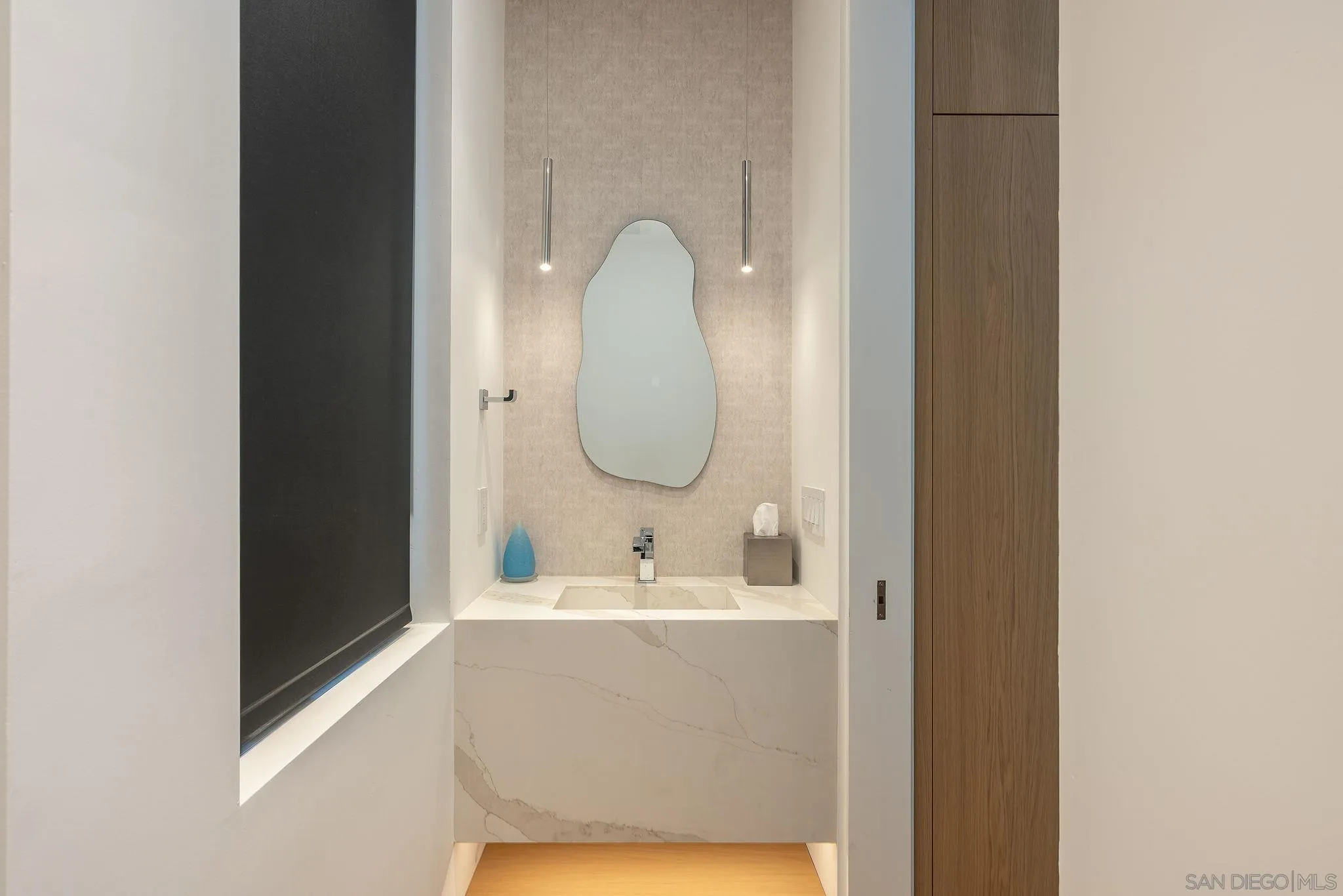 1605 Burgundy Road Encinitas, CA 92024 - Photo 13 of 39 a bathroom with a sink and a mirror