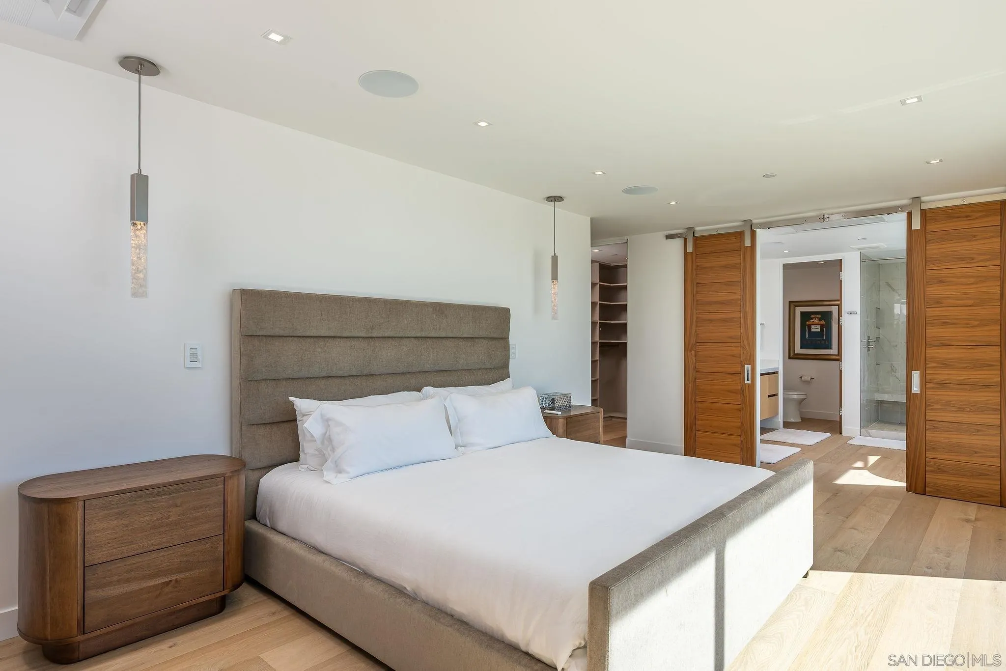 1605 Burgundy Road Encinitas, CA 92024 - Photo 25 of 39 a bedroom with a bed and a cabinets