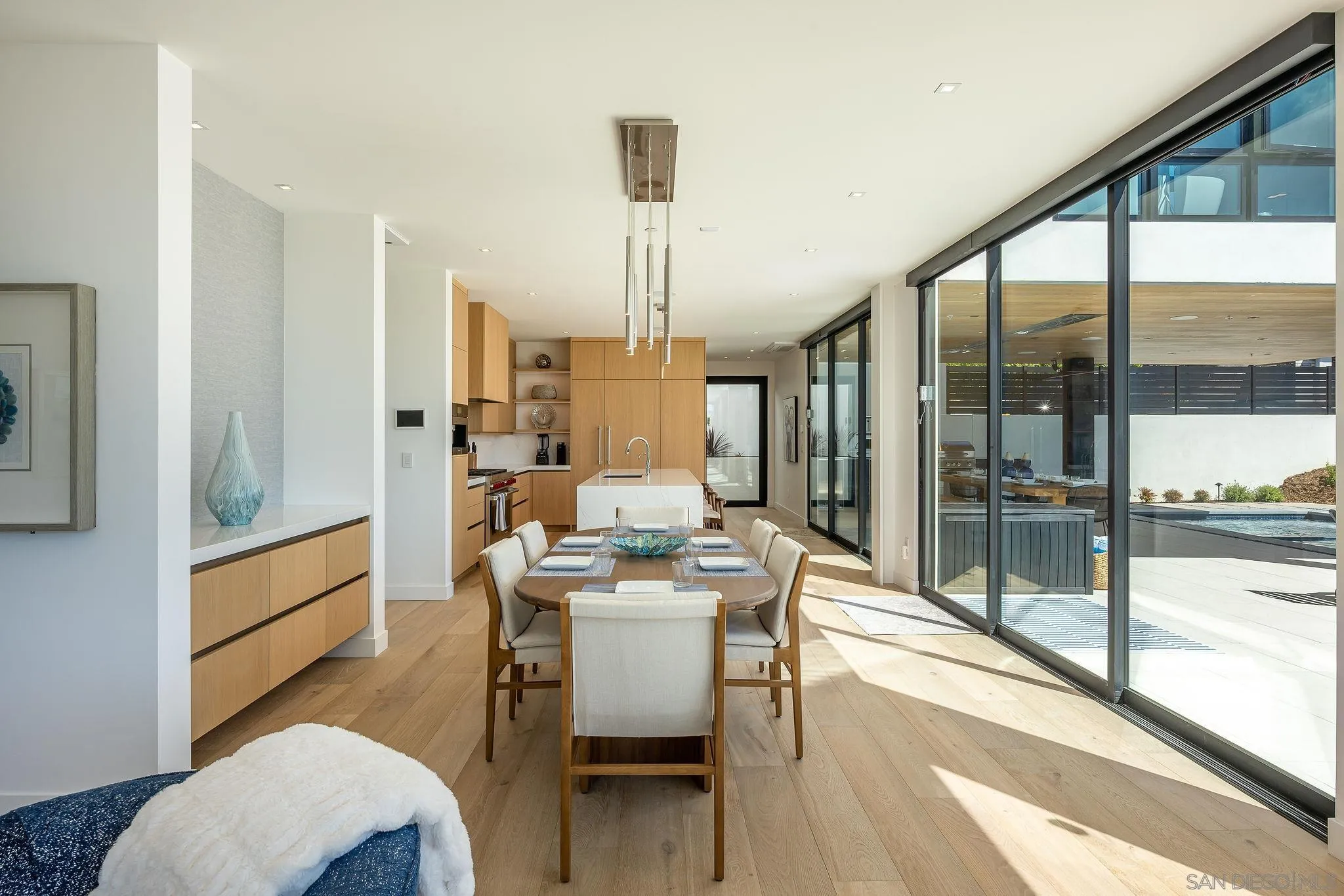 1605 Burgundy Road Encinitas, CA 92024 - Photo 10 of 39 a dining room with furniture and a floor to ceiling window
