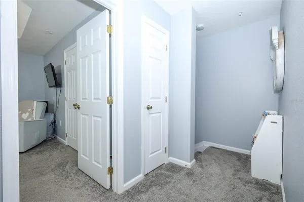 a view of a room with white walls