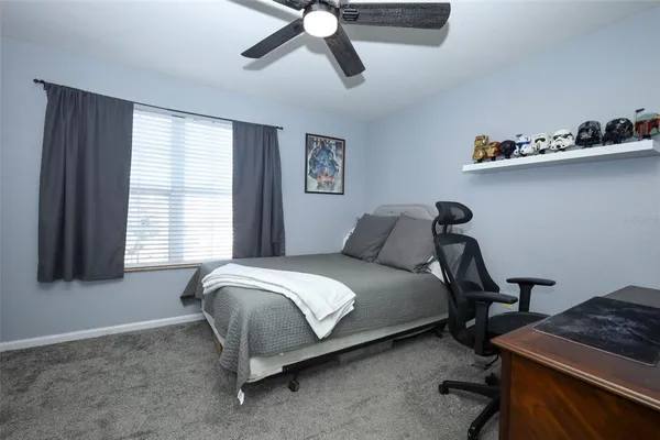 a bed room with a bed and a window