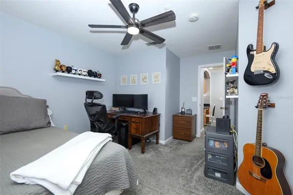 a bathroom with a sink a toilet and shower curtain