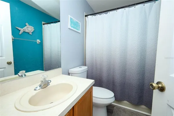 a bed room with a bed and a window