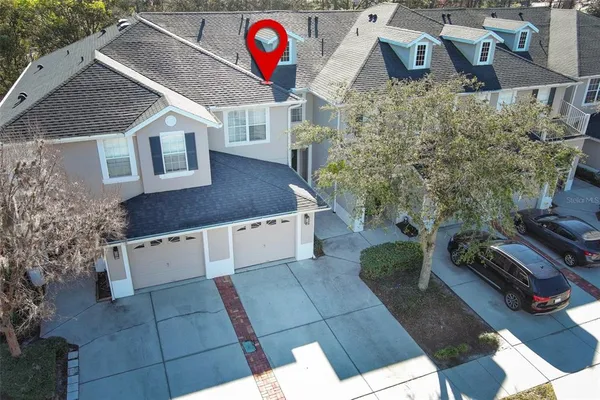 a aerial view of a house with a yard