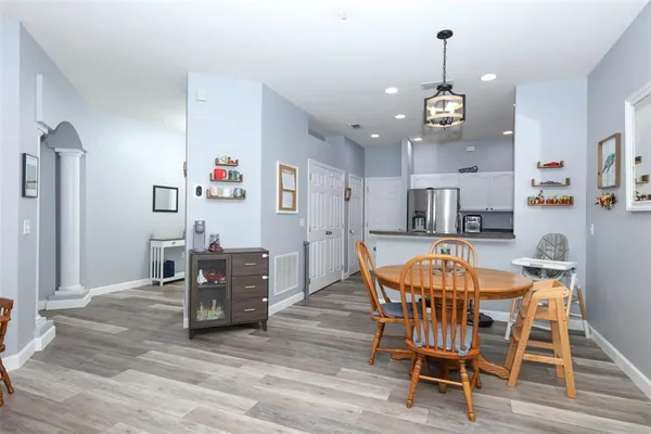 a view of a dining room with furniture and wooden floor