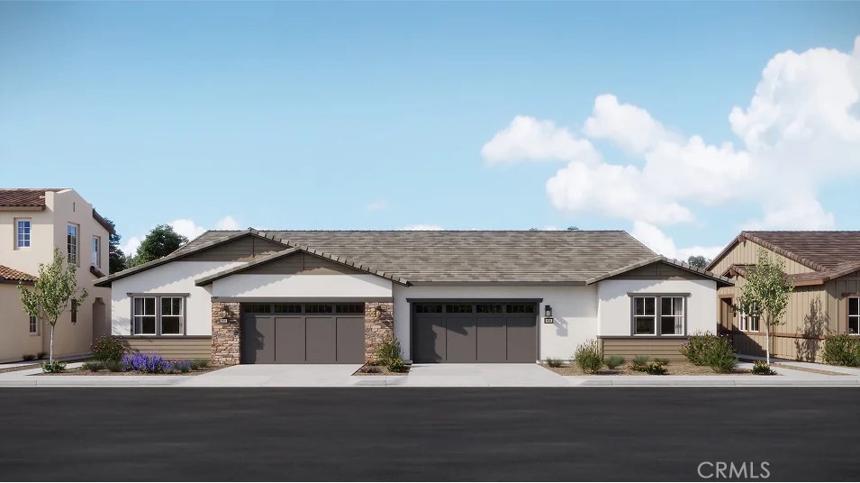 650 Furrow Road Rancho Mission Viejo, CA 92694 - Photo 11 of 22 a front view of a house with a garden