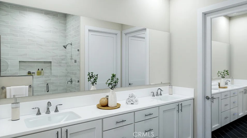 650 Furrow Road Rancho Mission Viejo, CA 92694 - Photo 9 of 22 a bathroom with double sink and a mirror