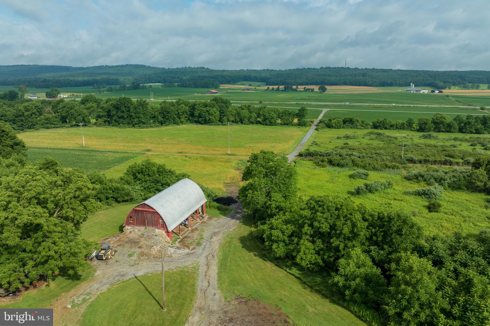 a view of a field with sitting area