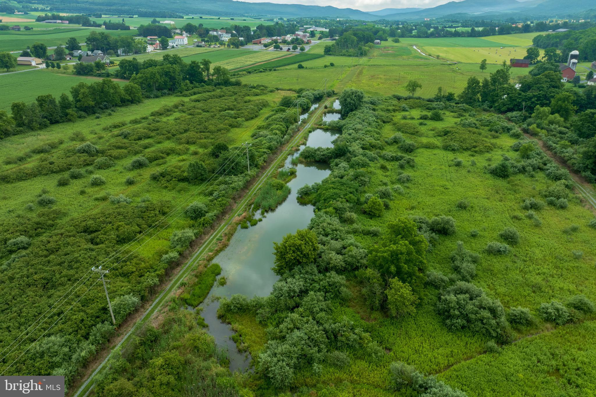 0 Hublersburg Road, Unit ENTIRETY Bellefonte, PA 16823 - Photo 17 of 58 a view of a lush green field with lots of trees in the background