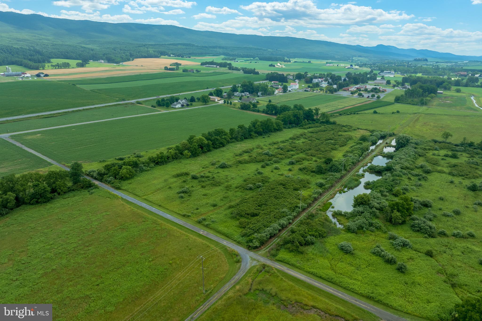 0 Hublersburg Road, Unit ENTIRETY Bellefonte, PA 16823 - Photo 21 of 58 a view of a green field with an ocean view