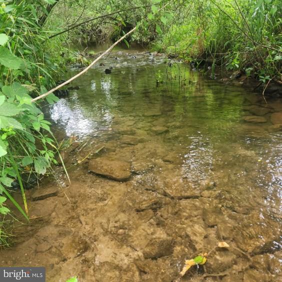 0 Hublersburg Road, Unit ENTIRETY Bellefonte, PA 16823 - Photo 48 of 58 a swimming pool with a garden space