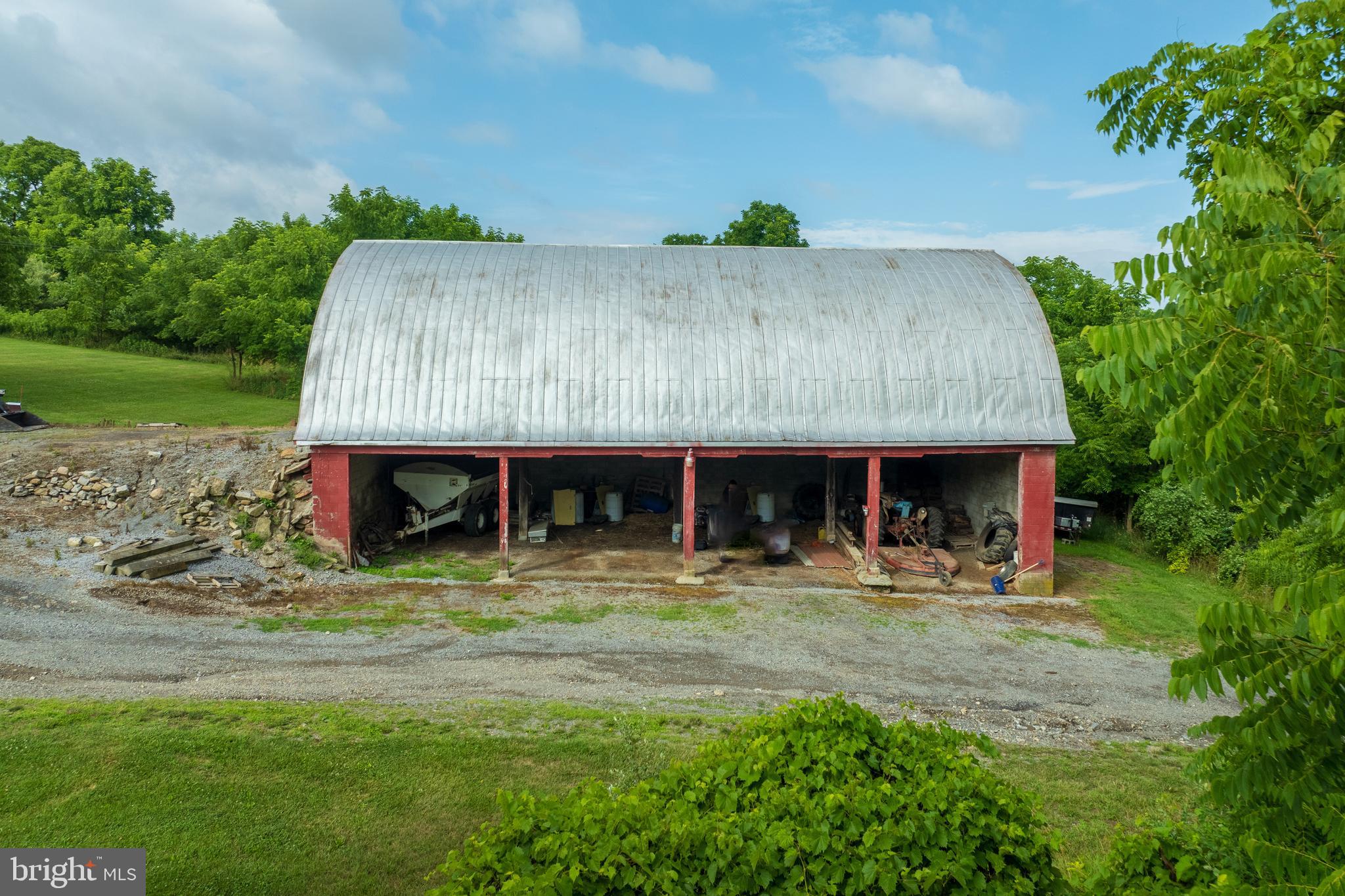 0 Hublersburg Road, Unit ENTIRETY Bellefonte, PA 16823 - Photo 5 of 58 a front view of a house with porch