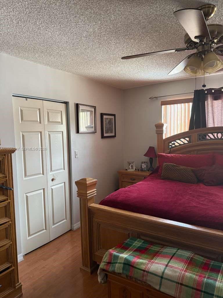 7477 Northwest 167th Street Hialeah, FL 33015 - Photo 16 of 24 a bedroom with furniture and a potted plant