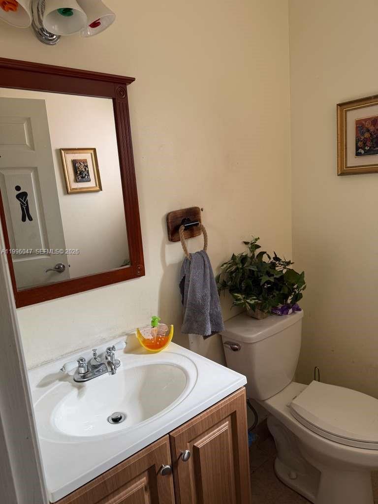 7477 Northwest 167th Street Hialeah, FL 33015 - Photo 17 of 24 a bathroom with a sink and a toilet