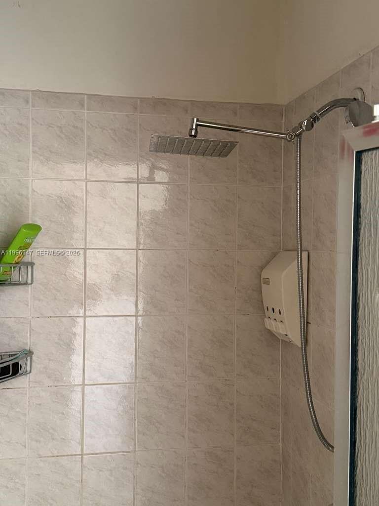 7477 Northwest 167th Street Hialeah, FL 33015 - Photo 19 of 24 a bathroom with a shower