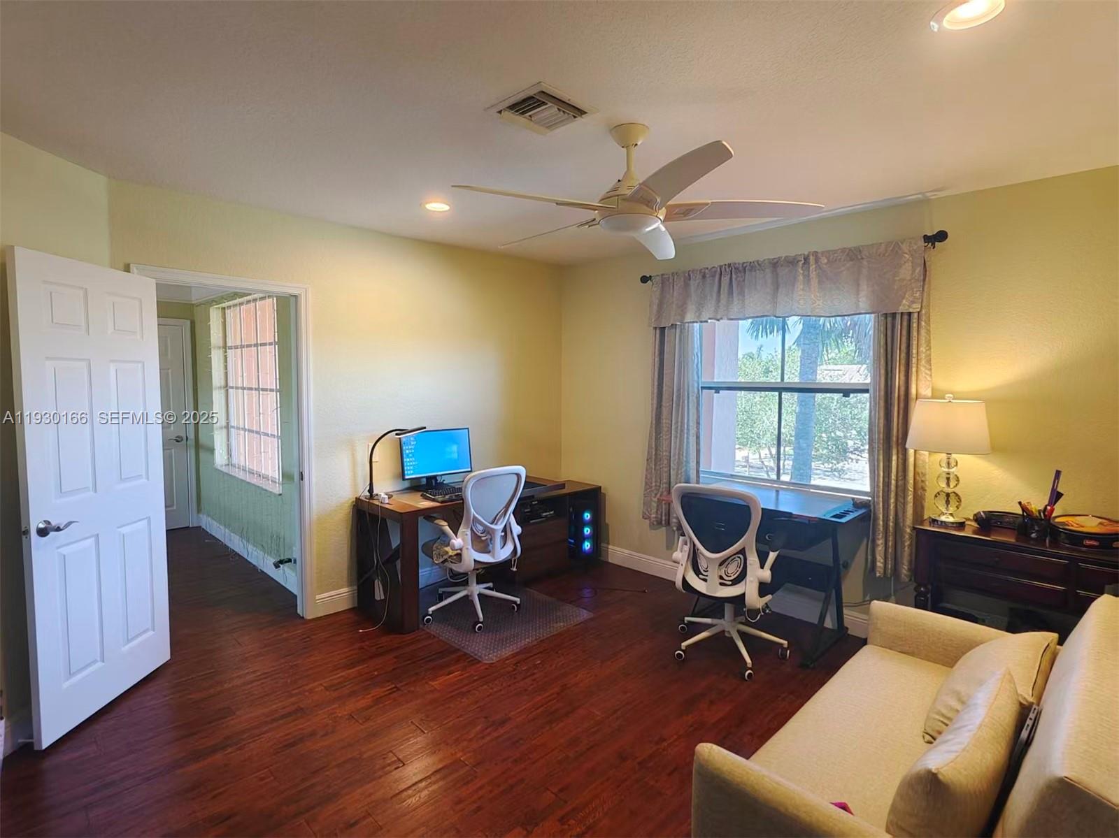 1035 Waterside Circle Weston, FL 33327 - Photo 24 of 40 a view of a workspace with furniture and a window