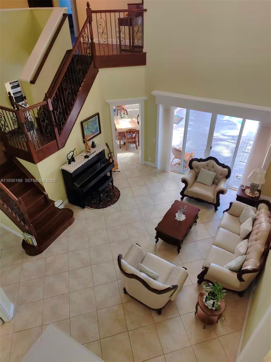 1035 Waterside Circle Weston, FL 33327 - Photo 3 of 40 a living room with furniture and a fireplace