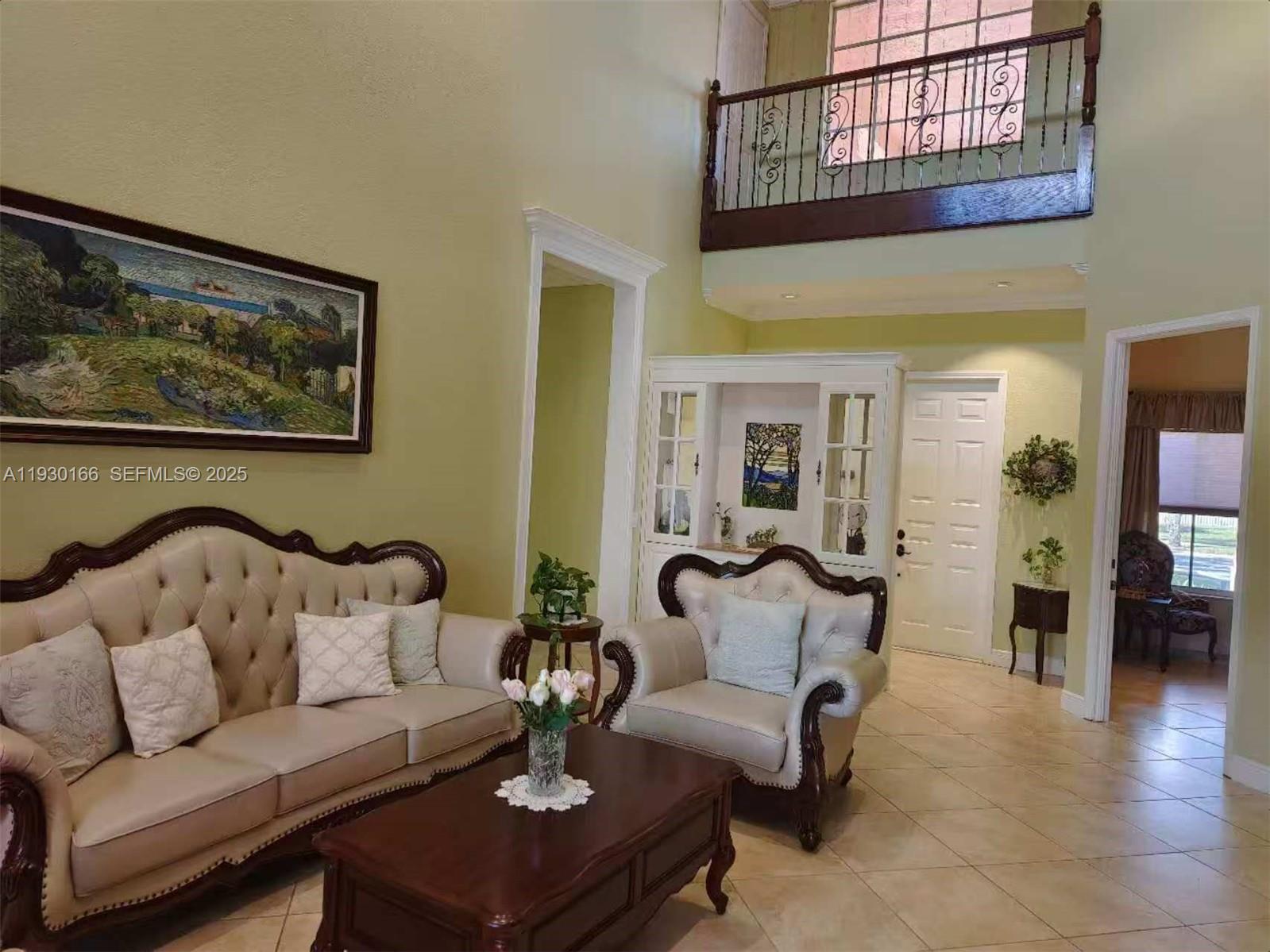 1035 Waterside Circle Weston, FL 33327 - Photo 33 of 40 a living room with furniture and a painting on the wall