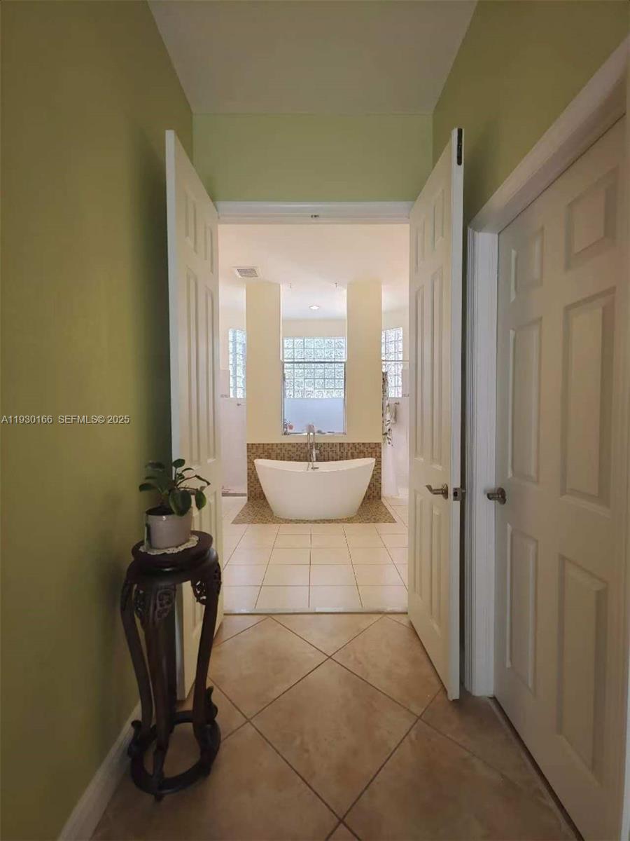 1035 Waterside Circle Weston, FL 33327 - Photo 9 of 40 a bathroom with a sink and a mirror