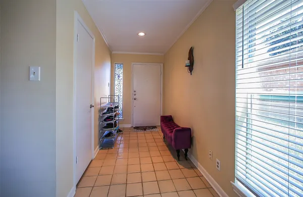 a view of an empty room and bathroom