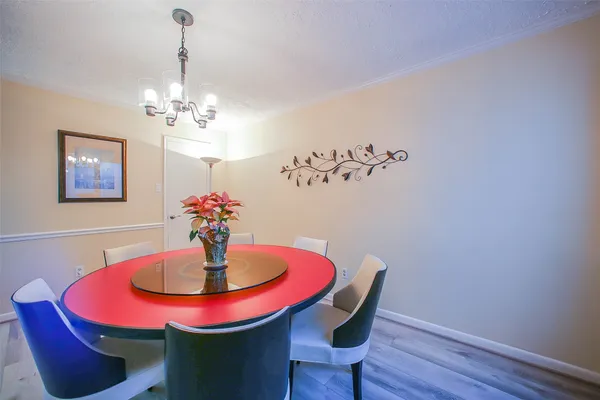 a dining room with table and chairs