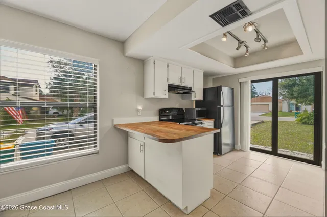 a kitchen with stainless steel appliances granite countertop a stove and a refrigerator