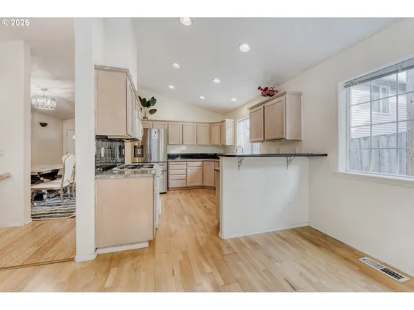 a view of kitchen with wooden floor