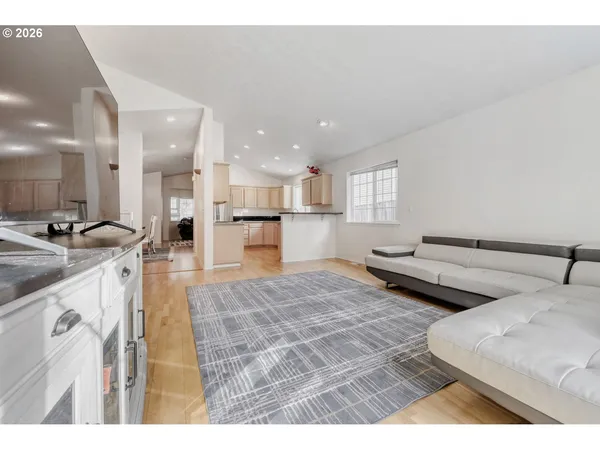 a view of a living room and kitchen