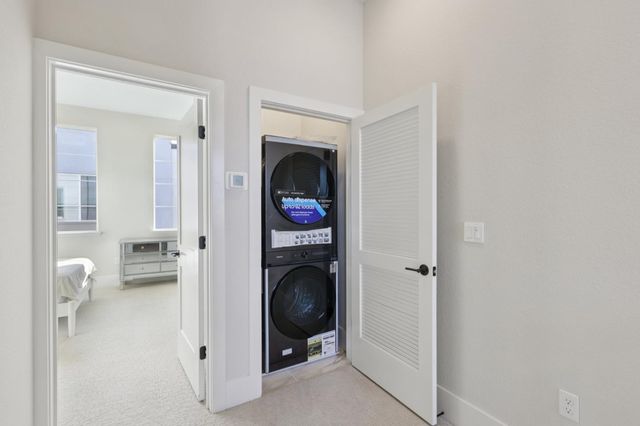 a view of livingroom with washer and dryer