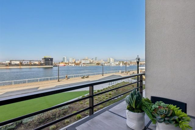a front view of a house with a yard and a garage
