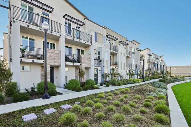 a front view of a building with garden