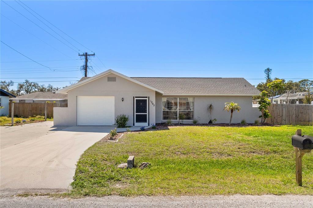 1245 Porpoise Road Venice, FL 34293 - Photo 1 of 1 a front view of a house with a yard