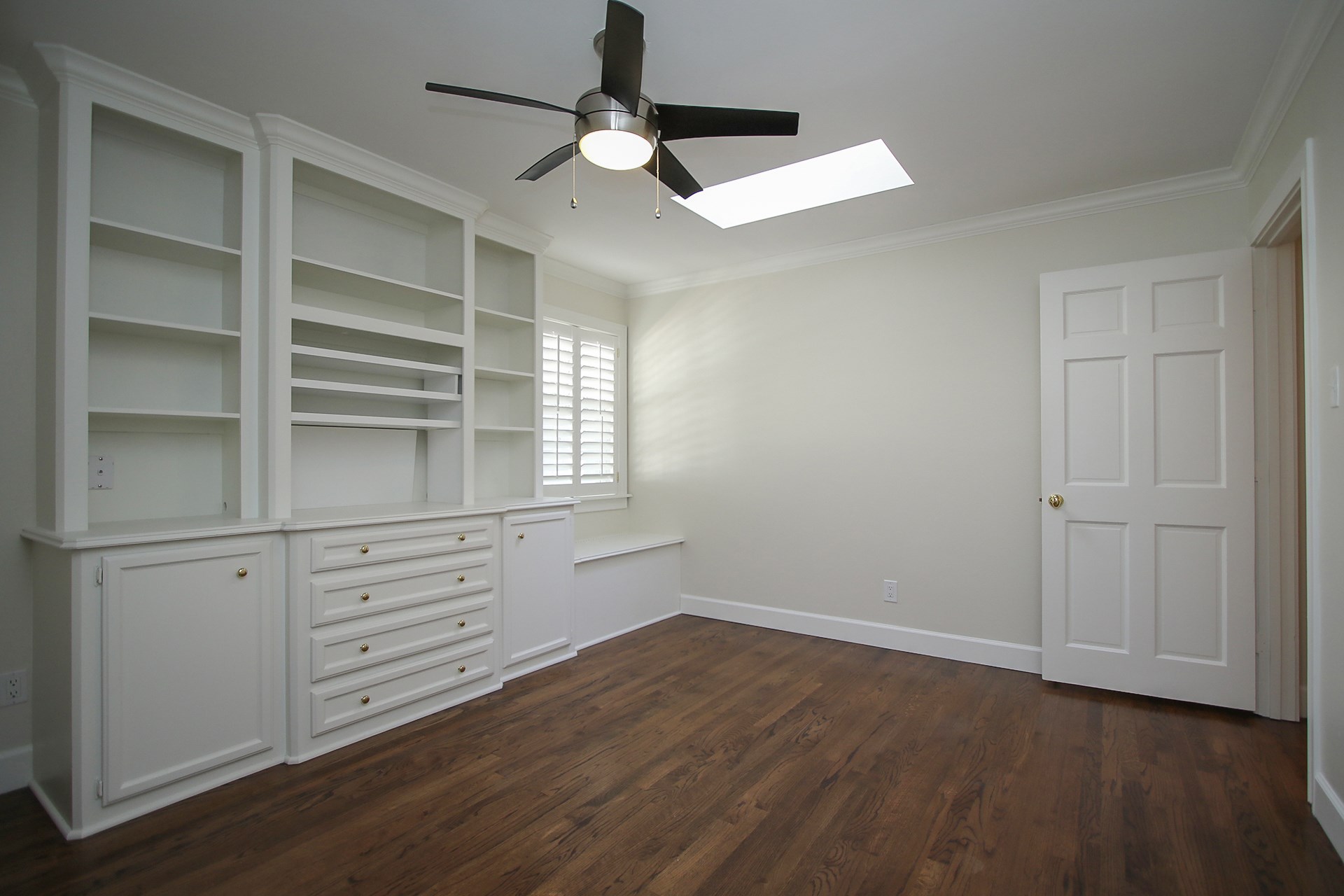 6208 Kirby Drive Houston, TX 77005 - Photo 16 of 19 a view of an empty room with a window and wooden floor
