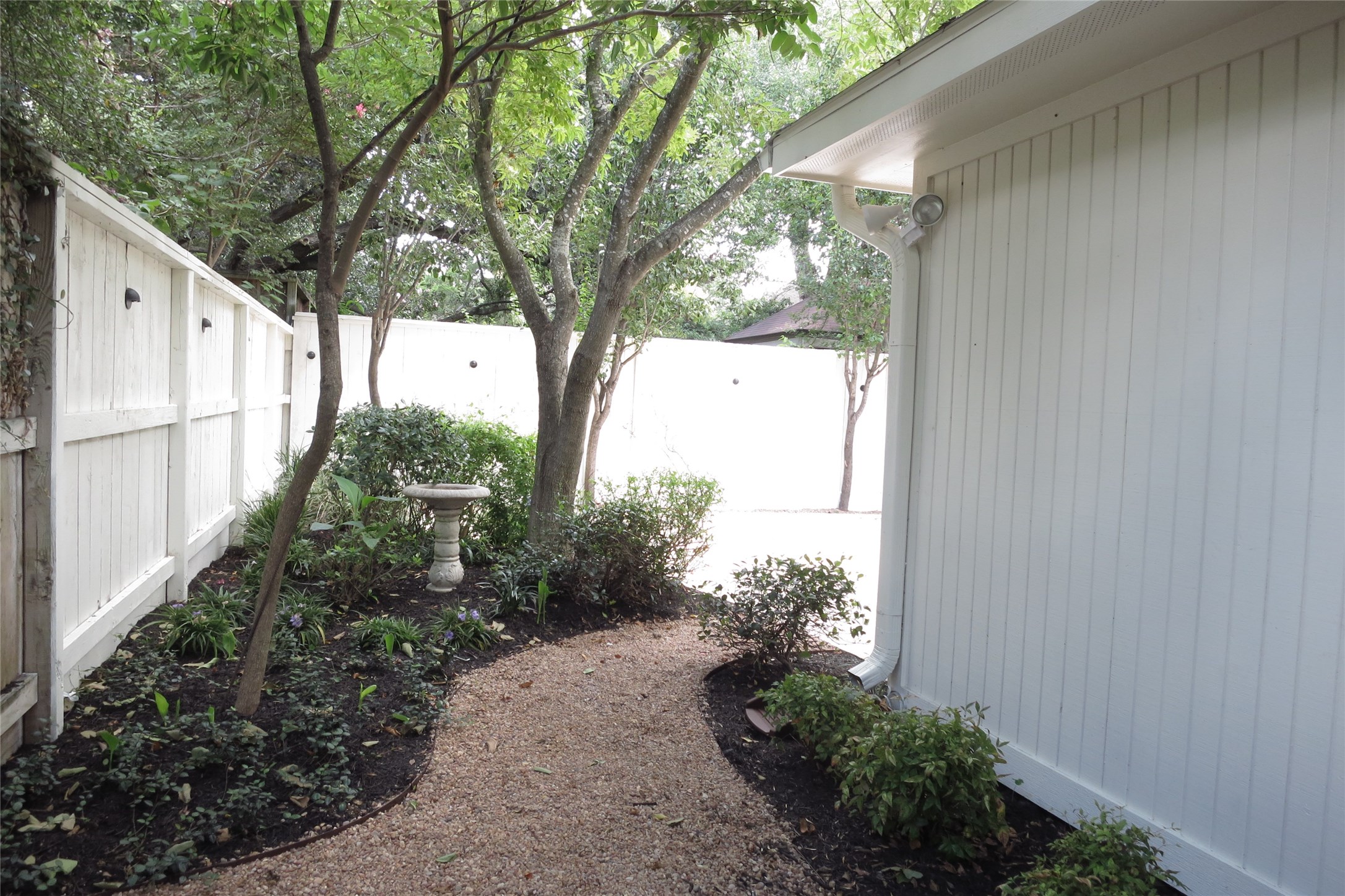 6208 Kirby Drive Houston, TX 77005 - Photo 17 of 19 a backyard of a house with lots of green space