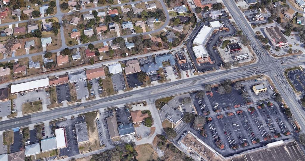 11001 Spring Hill Drive Spring Hill, FL 34608 - Photo 2 of 5 a large building with a outdoor space