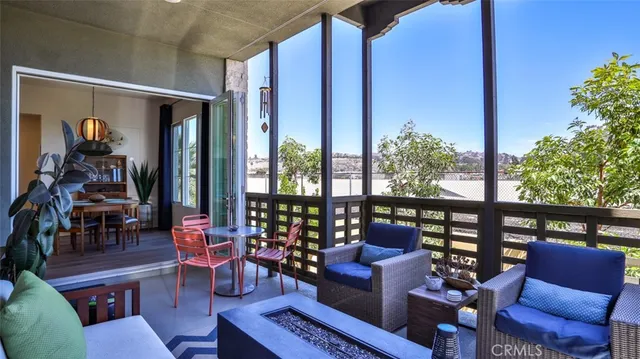 a kitchen with stainless steel appliances a table chairs and chandelier