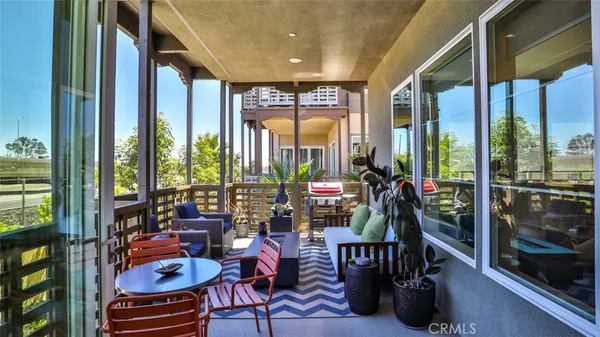a kitchen with kitchen island a table and chairs in it