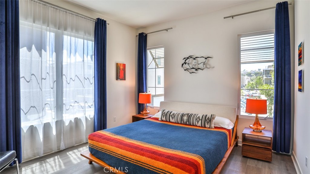 1207 Doheny Way Dana Point, CA 92629 - Photo 11 of 74 a bedroom with a bed and a window