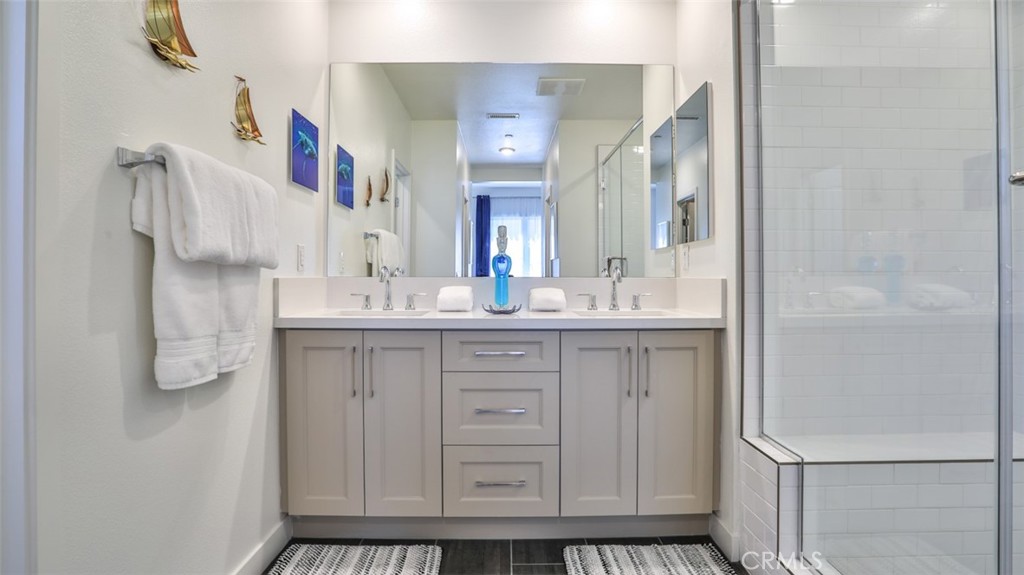 1207 Doheny Way Dana Point, CA 92629 - Photo 14 of 74 a bathroom with a sink and a mirror