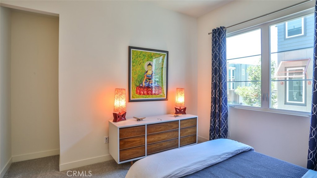 1207 Doheny Way Dana Point, CA 92629 - Photo 18 of 74 a bedroom with a bed and a window