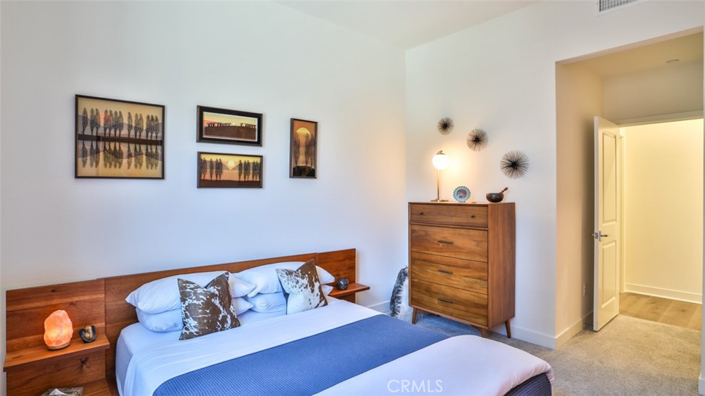 1207 Doheny Way Dana Point, CA 92629 - Photo 19 of 74 Secondary bedroom with walk-in closet and next to full hall bathroom.