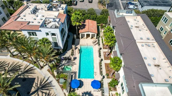 a swimming pool with outdoor seating and yard